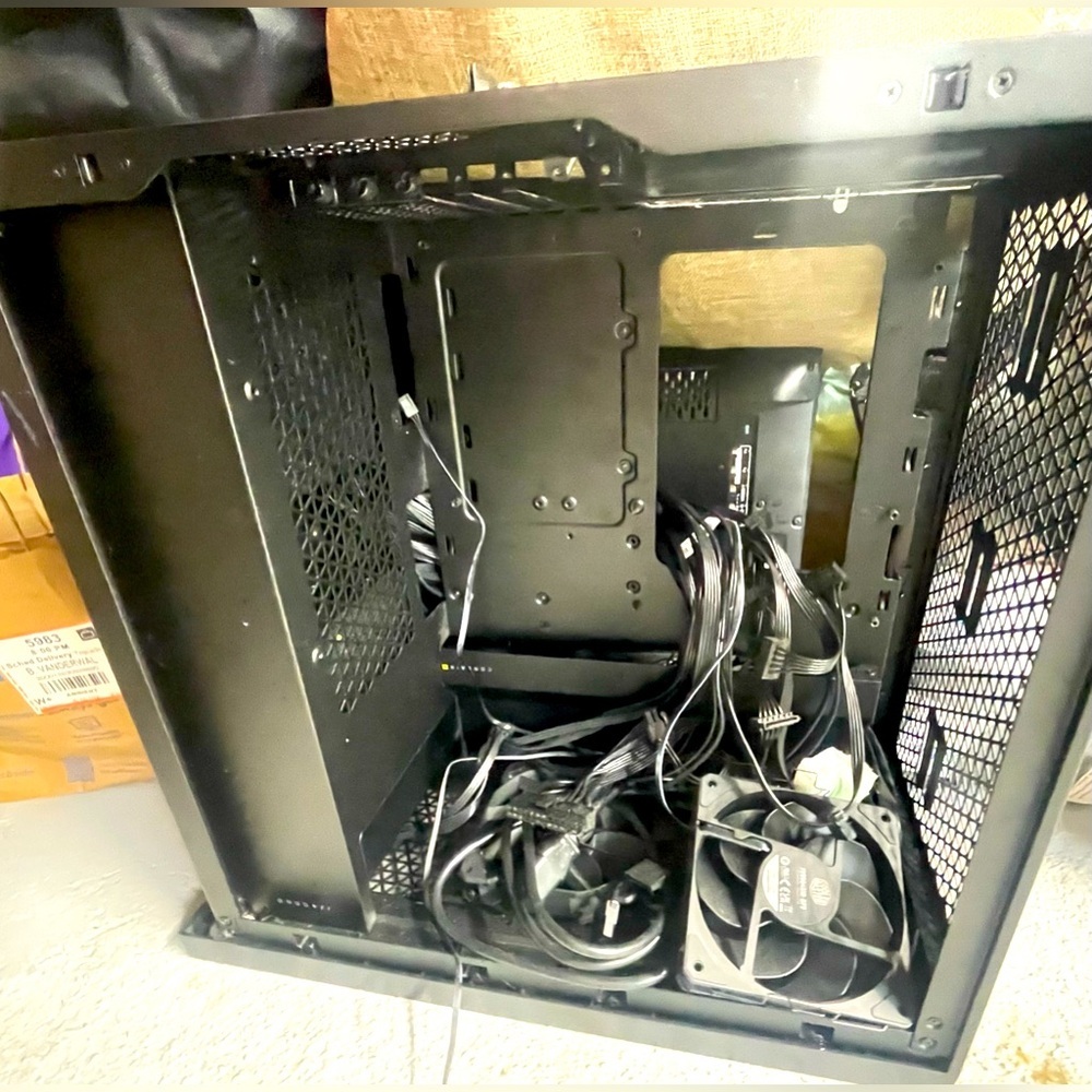 Computer Shell/Housing- black matte metal, has several fans & lots of ports.